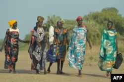 Women walk to the market in Udier town, in South Sudan on March 7, 2019.