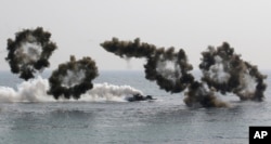 FILE - South Korean amphibious assault vehicles participate in a 2015 U.S.-South Korea joint military exercise.