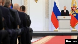 Rossiya Prezidenti Vladimir Putin Ukrainaning to'rt hududini Rossiya tarkibiga qo'shib olish haqidagi shartnomani imzolash marosimida nutq so'zlamoqda, Moskva, Rossiya, 2022-yil, 30-sentabr.