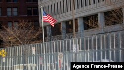 A security fence outside the US District Courthouse prior to opening statements in the trial of three former Minneapolis police officers charged with federal civil rights violations in George Floyd's death in St. Paul, Minnesota, Jan. 24, 2022. 