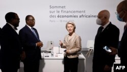 European Commission President Ursula von der Leyen speaks with the president of the African Development Bank, Senegal's President Macky Sall and Tunisia's president at a Summit on the Financing of African Economies, May 18, 2021.