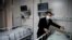Doctor Hangzhou Lu, co-director of Shanghai Public Clinical Center Shanghai, shows a quarantine room for coronavirus patients at finished but still unused building A2, in Shanghai, China, Feb. 17, 2020.