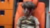 敘利亞空襲中受傷男童照片揪住人心