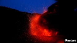 The Cumbre Vieja volcano continues to erupt on the Canary Island of La Palma, as seen from Tajuya, Spain, Oct. 19, 2021.