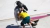 Kieran Woolley of Australia crashes into a cameraman&nbsp;in the men's park skateboarding preliminary round at the 2020 Summer Olympics in Tokyo, Japan.