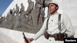 A Turkish soldier in historical uniform stands at a ceremony marking the 100th anniversary of the Battle of Canakkale, as part of the Gallipoli campaign in Gallipoli, March 18, 2015. 