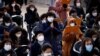 Buddhist believers pray for their children’s success in the college entrance examinations amid the coronavirus disease (COVID-19) pandemic, at a Buddhist temple in Seoul, South Korea, Dec. 2, 2020. 