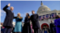 Joe Biden is sworn in as the 46th president of the United States by Chief Justice John Roberts as Jill Biden holds the Bible during the 59th Presidential Inauguration at the U.S. Capitol.
