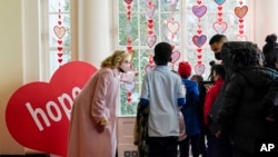 First lady Jill Biden talks with Aiton Elementary School students and staff as she welcomes school children to the White House, Feb. 14, 2022, to celebrate Valentine's Day. 