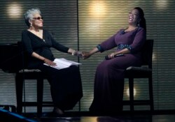 FILE - Maya Angelou and Oprah Winfrey share laughs during a star-studded double-taping of "Surprise Oprah! A Farewell Spectacular," Chicago, May 17, 2011.