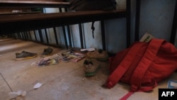 School bags and supplies belonging to pupils at the Government Science Secondary School are seen on the floor where gunmen abducted students, in Kankara, in northwestern Katsina state, Nigeria, Dec. 15, 2020.