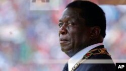 Zimbabwe's President Emmerson Mnangagwa prepares to inspect the guard of honour during the celebrations for the country's 38th anniversary of Independence at the National Sports Staduim in Harare, Wednesday, April, 18, 2018. Thousands of people gathered f