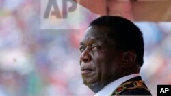 FILE: Zimbabwe's President Emmerson Mnangagwa prepares to inspect the guard of honour during the celebrations for the country's 38th anniversary of Independence at the National Sports Staduim in Harare, Wednesday, April, 18, 2018. Thousands of people gathered f