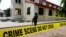 FILE: A police crime scene tape is seen in front of St. Francis Catholic Church where gunmen attacked worshippers during a Sunday mass service in Owo, Ondo, Nigeria. Taken the day after the attack, June 6, 2022.