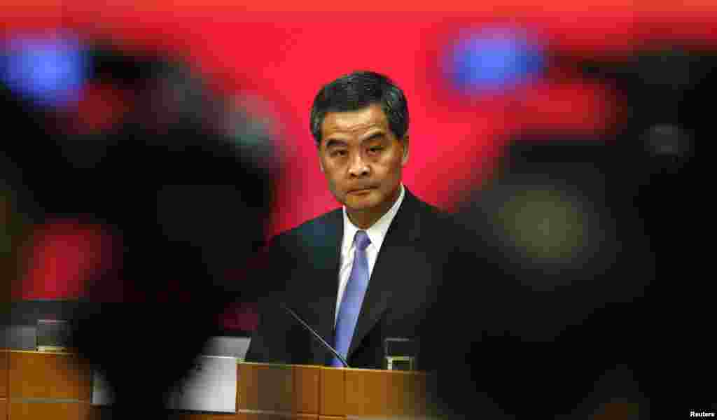 FIILE - Hong Kong Chief Executive Leung Chun-ying looks on in between video cameras during a news conference in Hong Kong July 15, 2014. 