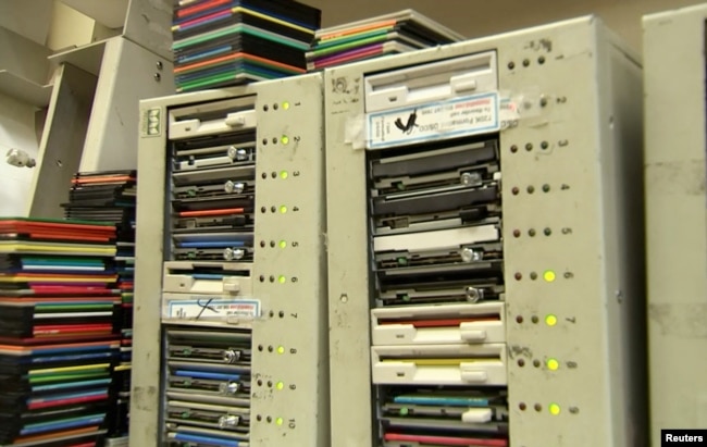 Tom Persky, the owner of floppydisk.com, uses older computers to format the disks that he sources from second-hand websites and eBay at his warehouse in Lake Forest, California, U.S., October 6, 2022 in this screengrab from a Reuters TV video. (REUTERS/Alan Devall)