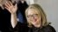 Hillary Rodham Clinton waves as she leaves State Department Feb. 1, 2013