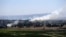 Smoke rises from the Israeli occupied Golan Heights near the Kuneitra border crossing, close to the ceasefire line between Israel and Syria, June 6, 2013.