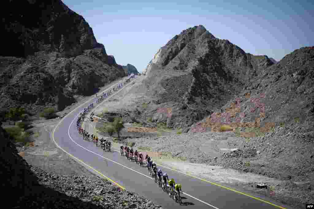 The pack rides during the fourth stage of the Tour of Oman cycling race from Oman Across Ages Museum to Oman Convention Center.