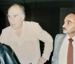 French movie star Michel Piccoli (L) stands next to prominent Egyptian movie critic Youssef Cherif Rizkallah at a press conference in Cairo, Egypt, Nov. 1987. (Photo: Diaa Bekheet)