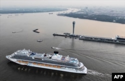 This aerial photo shows China's first domestically built cruise ship "The Adora Magic City" on its maiden voyage in Shanghai on January 1, 2024. (AFP)