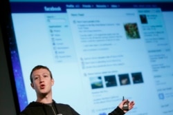 FILE - Facebook CEO Mark Zuckerberg gestures while speaking during a media event at Facebook headquarters in Menlo Park, California, March 7, 2013.