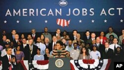 First lady Michelle Obama introduces her husband, President Barack Obama, while at a stop at Joint Base Langley-Eustis, in Hampton, Virginia, October 19, 2011.