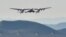 FILE - A Virgin Galactic rocket plane, the WhiteKnightTwo carrier airplane, with SpaceShipTwo passenger craft takes off from Mojave Air and Space Port in Mojave, California, Feb. 22, 2019.