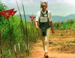 FILE - Diana, Princess of Wales is seen in this Jan. 15 1997 file picture walking in one of the safety corridors of the land mine fields of Huambo, Angola during her visit to help a Red Cross campaign to outlaw landmines worldwide.
