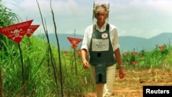 FILE - Diana, Princess of Wales is seen in this Jan. 15 1997 file picture walking in one of the safety corridors of the land mine fields of Huambo, Angola during her visit to help a Red Cross campaign to outlaw landmines worldwide.