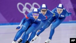 Team South Korea with Kim Bo-reum, front, Park Ji Woo, in second position, and Noh Seon-yeong, in last position, compete in the women's team pursuit speedskating race for seventh and eight place at the Gangneung Oval at the 2018 Winter Olympics in Gangneung, South Korea, Feb. 21, 2018.