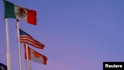 The flags of Mexico, the United States and Canada fly in Ciudad Juarez, Mexico, Feb. 1, 2025.