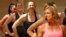 Women participate in a fitness class lead by Kira Stokes, right, at NYSC Lab in New York, May 11, 2017.