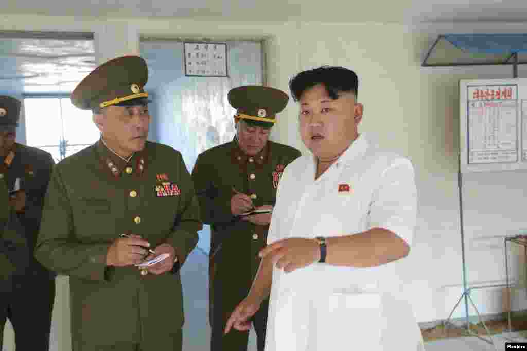 Korean leader Kim Jong Un provides field guidance to the construction sites of Pyongyang Baby Home and Orphanage in this undated photo released by North Korea's Korean Central News Agency (KCNA) in Pyongyang, August 13, 2014.