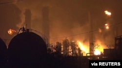 Flames rise over a petrochemical plant after an explosion in a still image from video in Port Neches, Texas, U.S., Nov. 27, 2019.