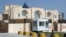 FILE - The new office of the Afghan Taliban in Doha, Qatar is seen after the opening of the office, June 20, 2013 . 