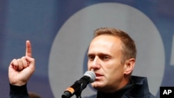 Russian opposition leader Alexei Navalny speaks during a rally to support political prisoners in Moscow, Russia, Sept. 29, 2019.