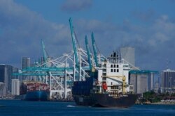 FILE - The Warnow-Dolphin container ship enters PortMiami, in Miami Beach, Fla., April 29, 2021.