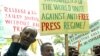 FILE - Ethiopian journalists hold placards as they shout slogans during a demonstration at the Ethiopian Embassy in Nairobi, May 2, 2006.