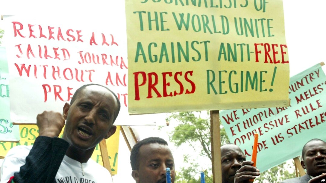 FILE - Ethiopian journalists hold placards as they shout slogans during a demonstration at the Ethiopian Embassy in Nairobi, May 2, 2006.