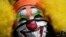 A clown wearing a protective face mask as a precaution against the spread of the new coronavirus attends a protest in Mexico City, April 30, 2020. 