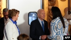 US President Joe Biden greets people as he arrives at Lindo Michoacan restaurant ahead of a radio interview in Las Vegas, Nevada, on July 17, 2024.