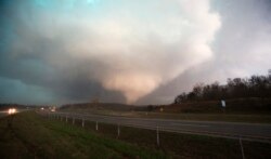 FILE - A tornado rips through part of Oklahoma.