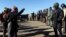Police block the highway from protesters next to the pipeline route during a protest against the Dakota Access pipeline near the Standing Rock Sioux Reservation in St. Anthony, N.D., Nov. 11, 2016.