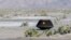 ARCHIVO – En esta imagen, proporcionada por la NASA, la cápsula de transporte de muestras de la misión Osiris-Rex de la NASA yace en el suelo tras aterrizar en el desierto en Utah el 24 de septiembre de 2023. 