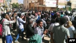 Sudanese protesters chant slogans during an anti-government demonstration in the capital Khartoum, Jan. 6, 2019.