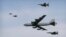 A U.S. Air Force B-52 bomber flies over Osan Air Base in Pyeongtaek, South Korea, Jan. 10, 2016. The bomber flew low over South Korea on Sunday, a show of force from the U.S. as a Cold War-style standoff deepened between ally Seoul and North Korea.