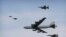 FILE - A U.S. Air Force B-52 bomber flies over Osan Air Base in Pyeongtaek, South Korea, Jan. 10, 2016. The bomber flew low over South Korea on Sunday, a show of force from the US as a Cold War-style standoff deepened between ally Seoul and North Korea.
