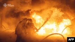 This handout photograph taken and released by Ukrainian State Emergency Service on Feb. 2, 2025 shows firefighters putting out a fire in Eastern Ukraine Sumy region following a Russian strike.