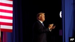 President Donald Trump applauds as he departs after speaking about tax reform at the Farm Bureau Building at the Indiana State Fairgrounds, in Indianapolis, Indiana, Sept. 27, 2017.